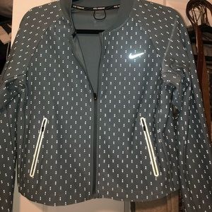 Nike like-new Drifit reflective cropped jacket